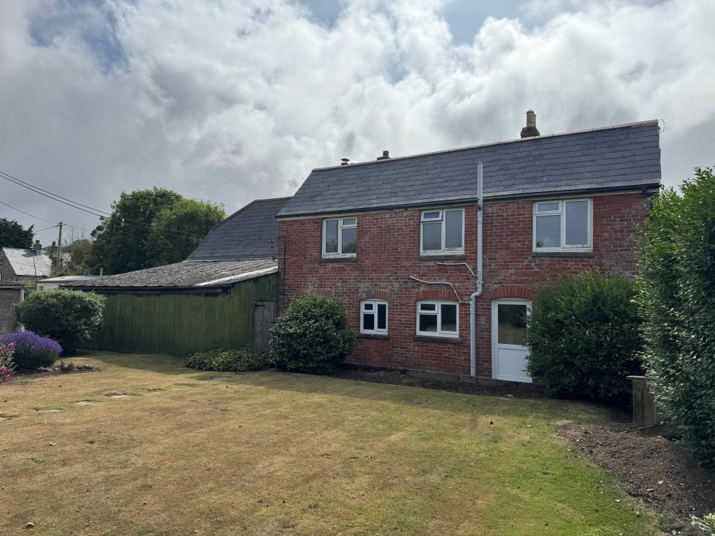 Lot: 53 - TRADITIONAL FARMHOUSE FOR IMPROVEMENT WITH BARNS AND OUTBUILDINGS ON A 2.5 ACRE PLOT - A View of the Rear of the Farmhouse